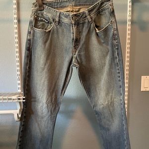 Volcom mens 34x32 distressed jeans, bottom of jeans around the hem each side cut